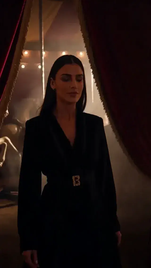 A luxury perfume teaser — circus backstage, then the Crimson Carnival bottle under a single spotlight